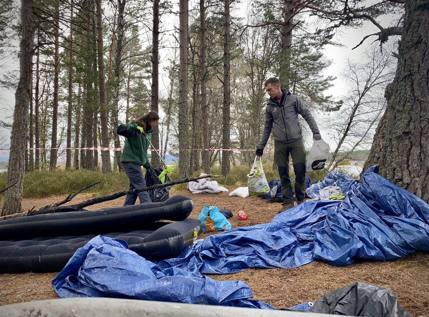 CNPA Rangers get to work clearing the dirty campers' rubbish at Loch Morlich