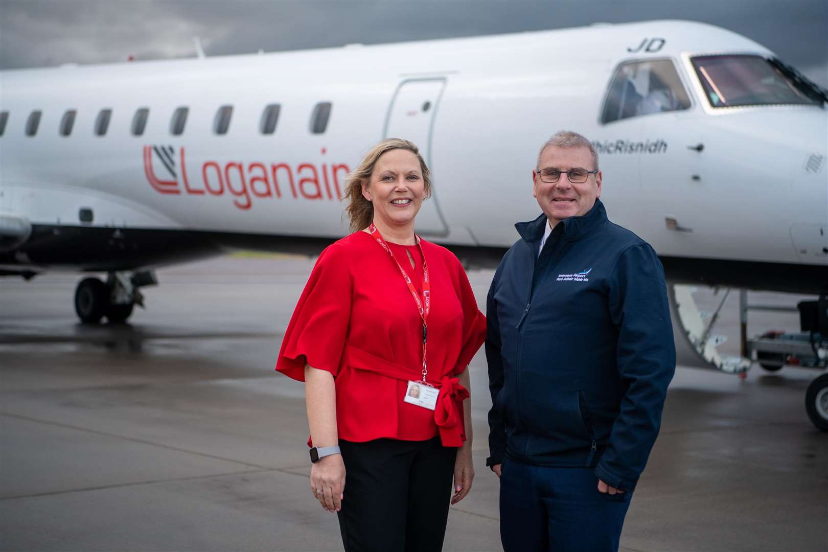 Donna McHugh, head of revenue and sales at Loganair, and Davie Geddes, terminal operation manager at Inverness Airport.