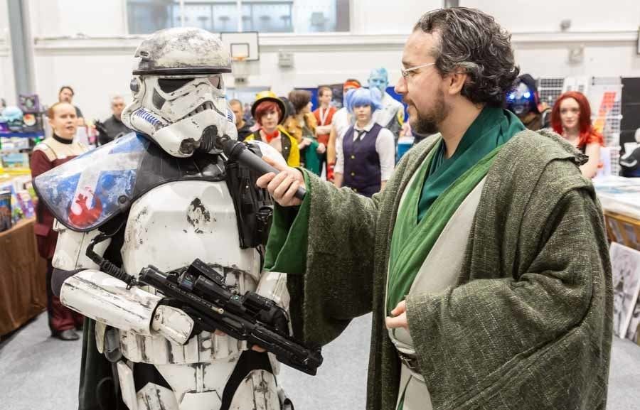 A Star Wars stormtrooper tackles "rebel scum" at a previous Comic Con event