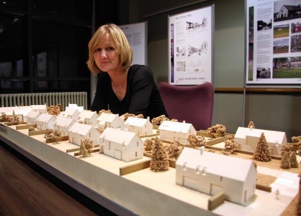 Urban designer Karen Cadell, of Area, overlooks a street model within the proposed development
