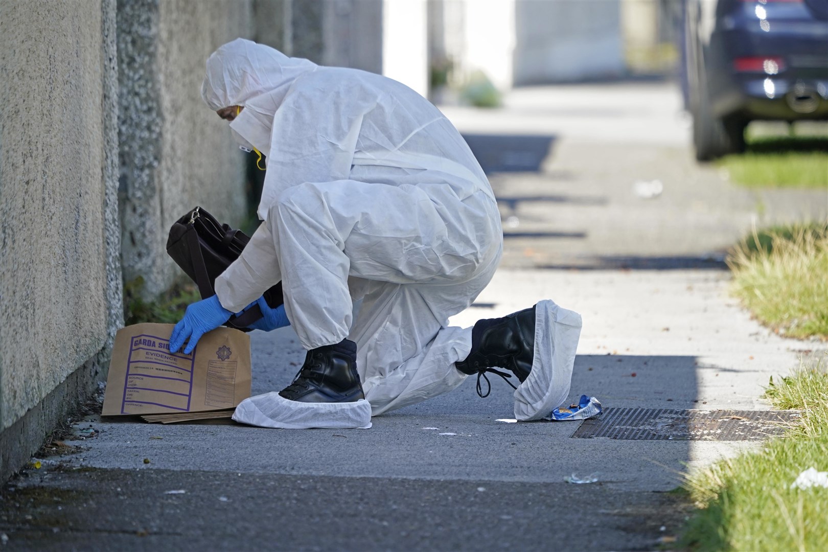 Forensic officers at the scene in the Rossfield Estate in Tallaght (Niall Carson/PA)