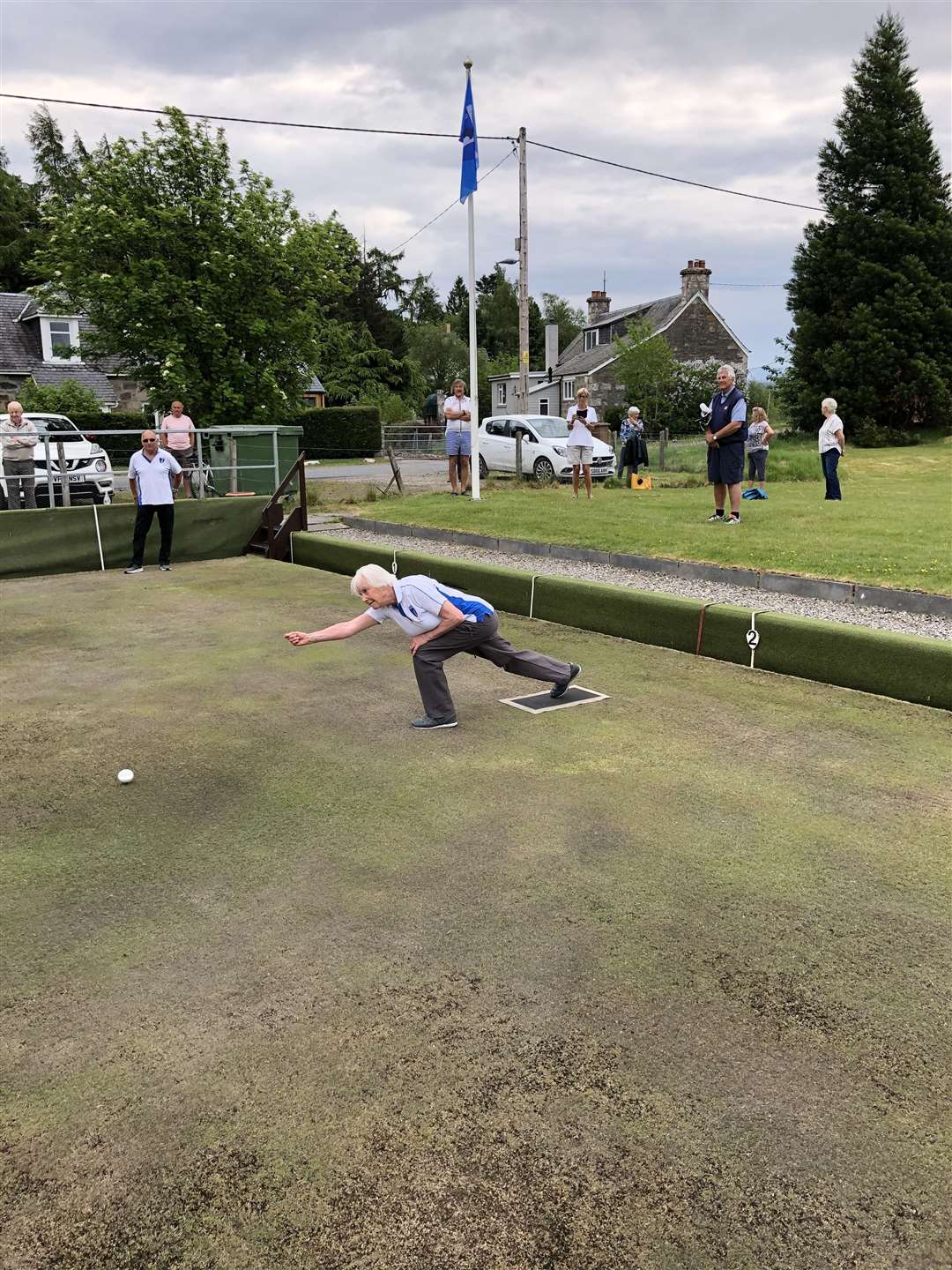 Jean Slimon throws the first jack of the 2020 season at Newtonmore Bowling Club.