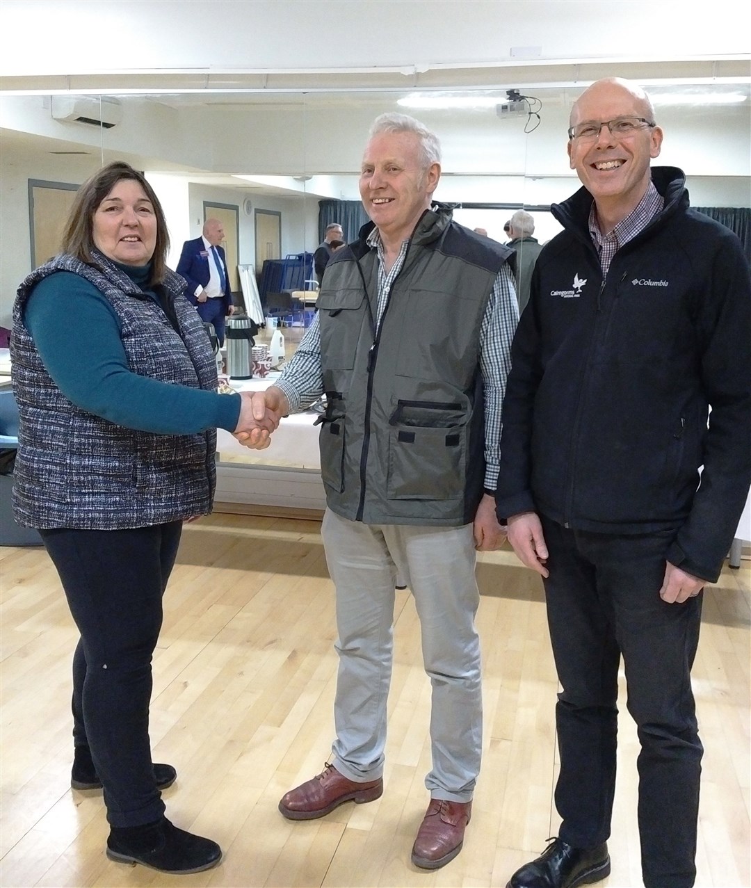 John Kirk (centre) is well-known in farming and community circles. He was a long time chair of Nethy Bridge Community Council and sits on the Cairngorms National Park Authority board. Here he is congratulated on his election to the board.