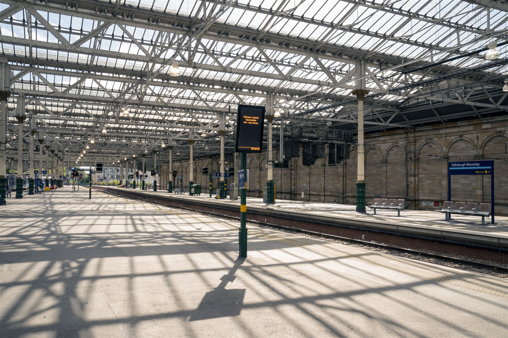 Empty platforms at Edinburgh’s Waverley Station during unrelated strikes last month (PA)