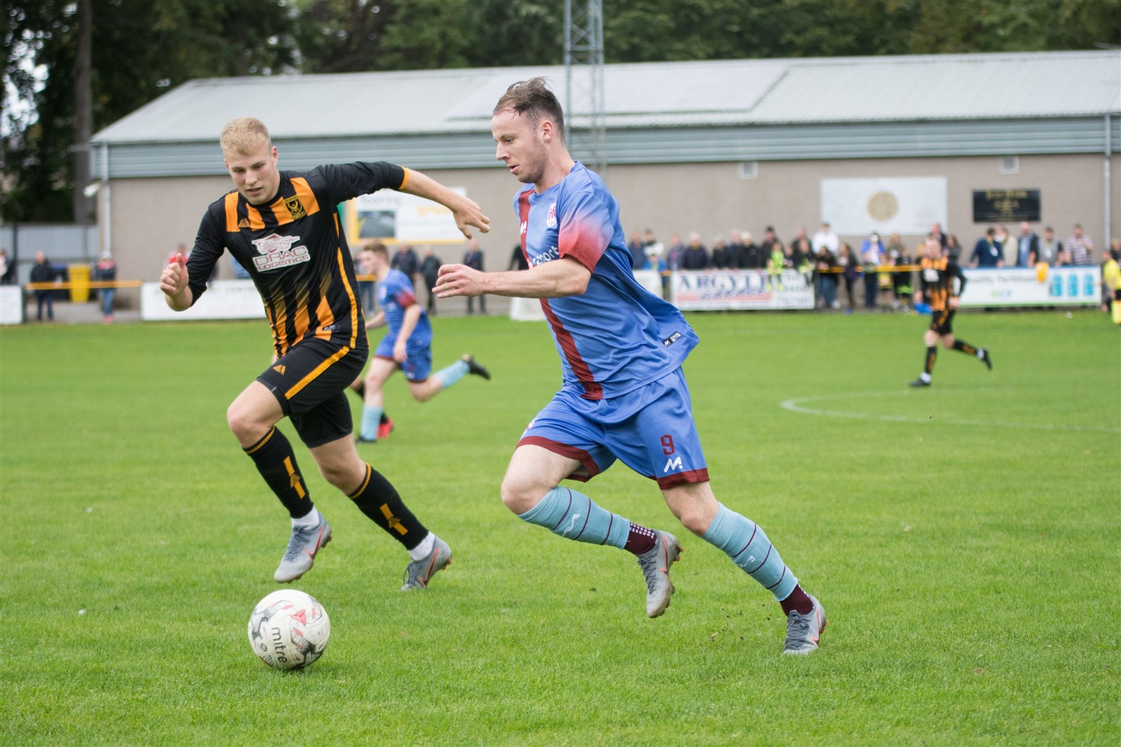 Ashley Ballam (left) during his loan spell for Huntly closes down Keith's Michael Selfridge. Picture: Becky Saunderson