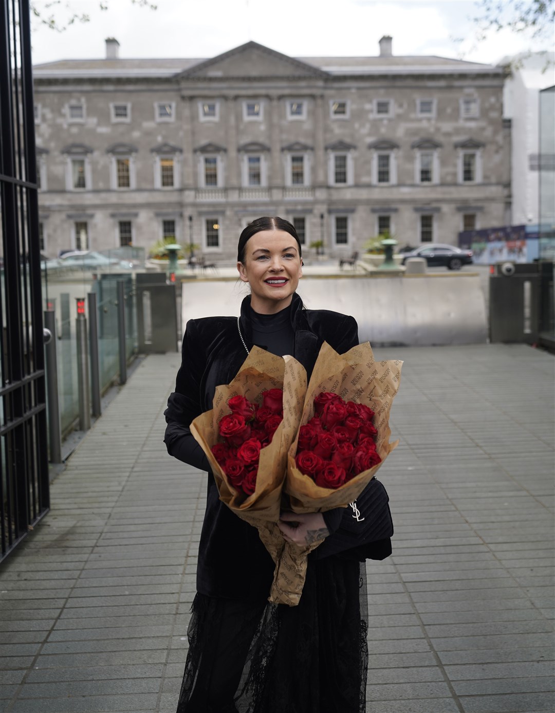 Lisa Lawlor, who was 17 months old when her parents Francis and Maureen Lawlor died in the Stardust fire, arrives at Leinster House, Dublin (Niall Carson/PA)