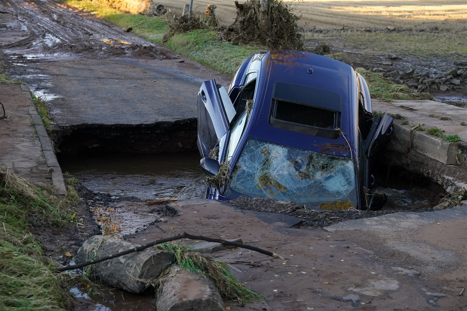 A car on a bridge washed away near Dundee following torrential rain (Andrew Milligan/PA)