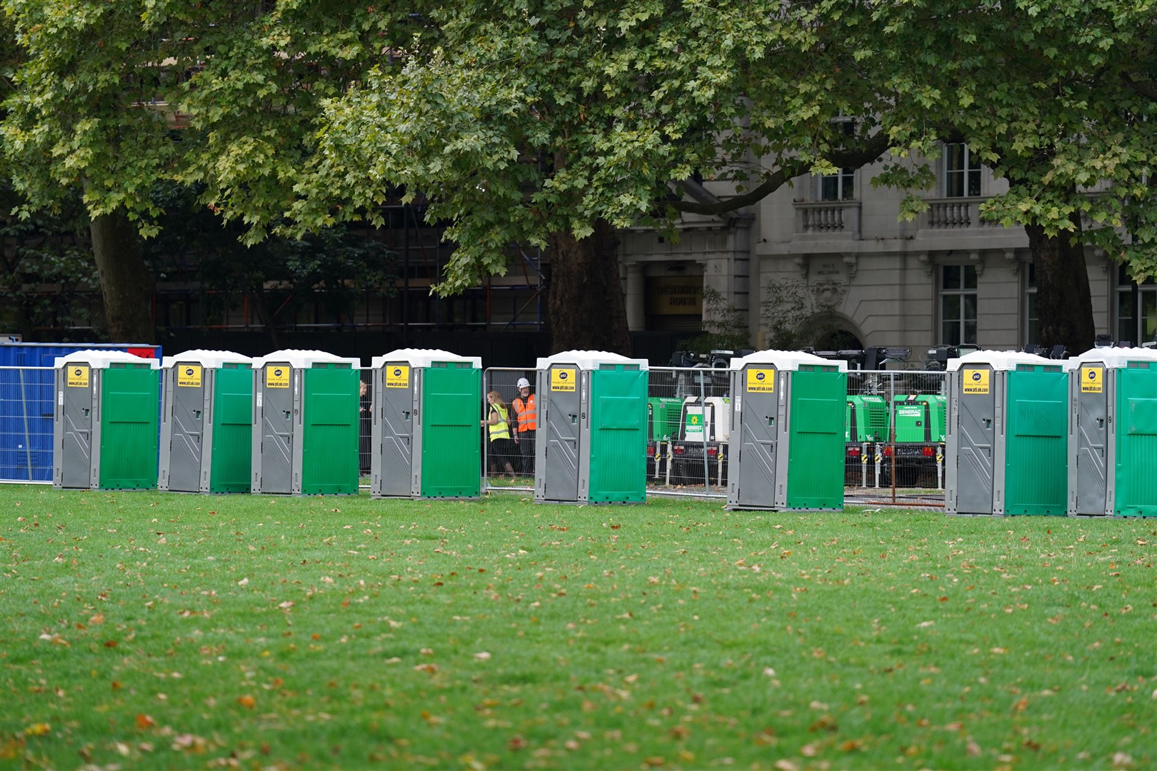 Barriers and portable toilets are erected in Westminster, London, ahead of the Queen’s lying in state (Stefan Rousseau/PA)