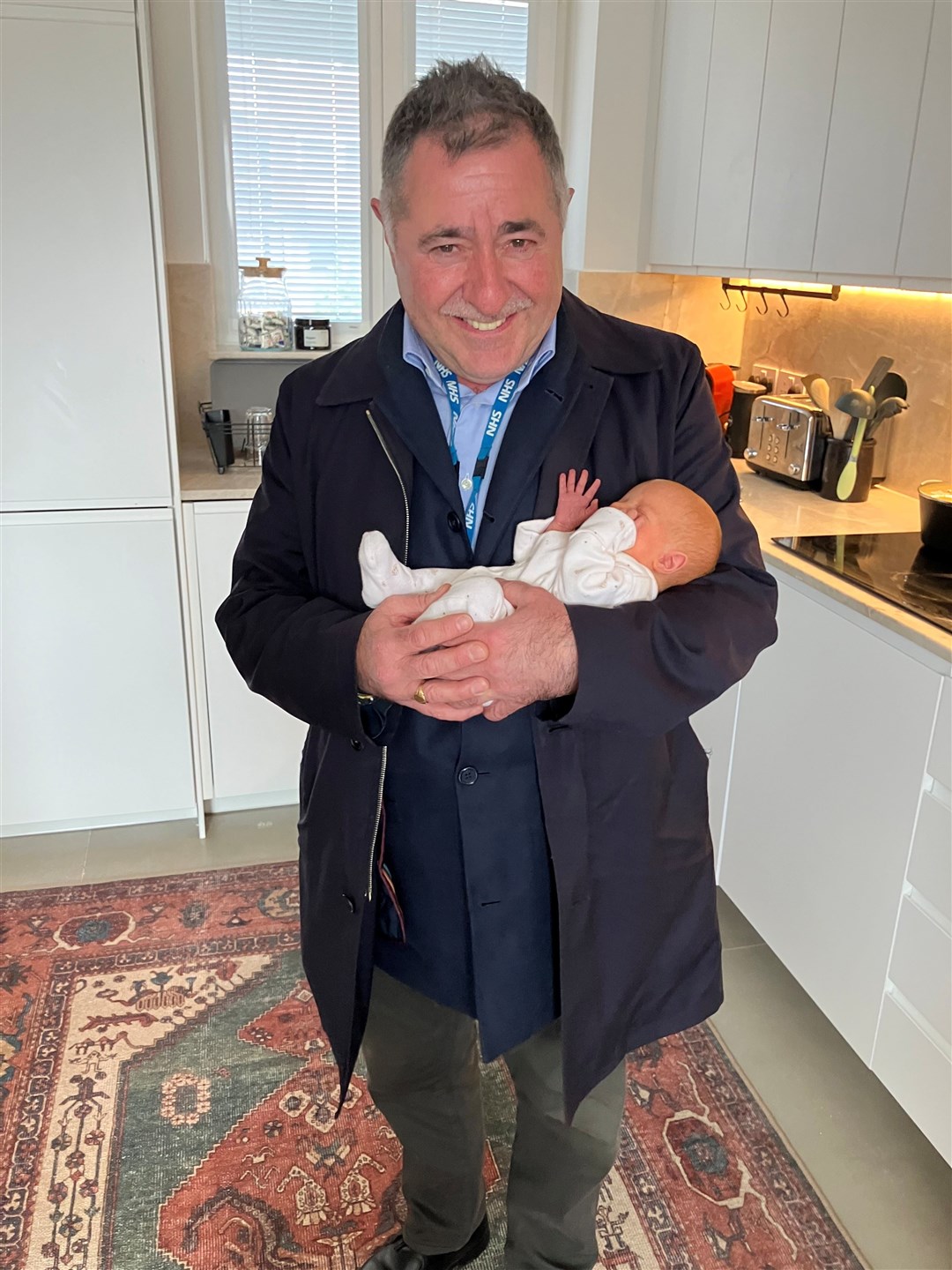 Professor Richard Smith, holding Amy, has been working on womb transplant research for 25 years (Womb Transplant UK/PA)