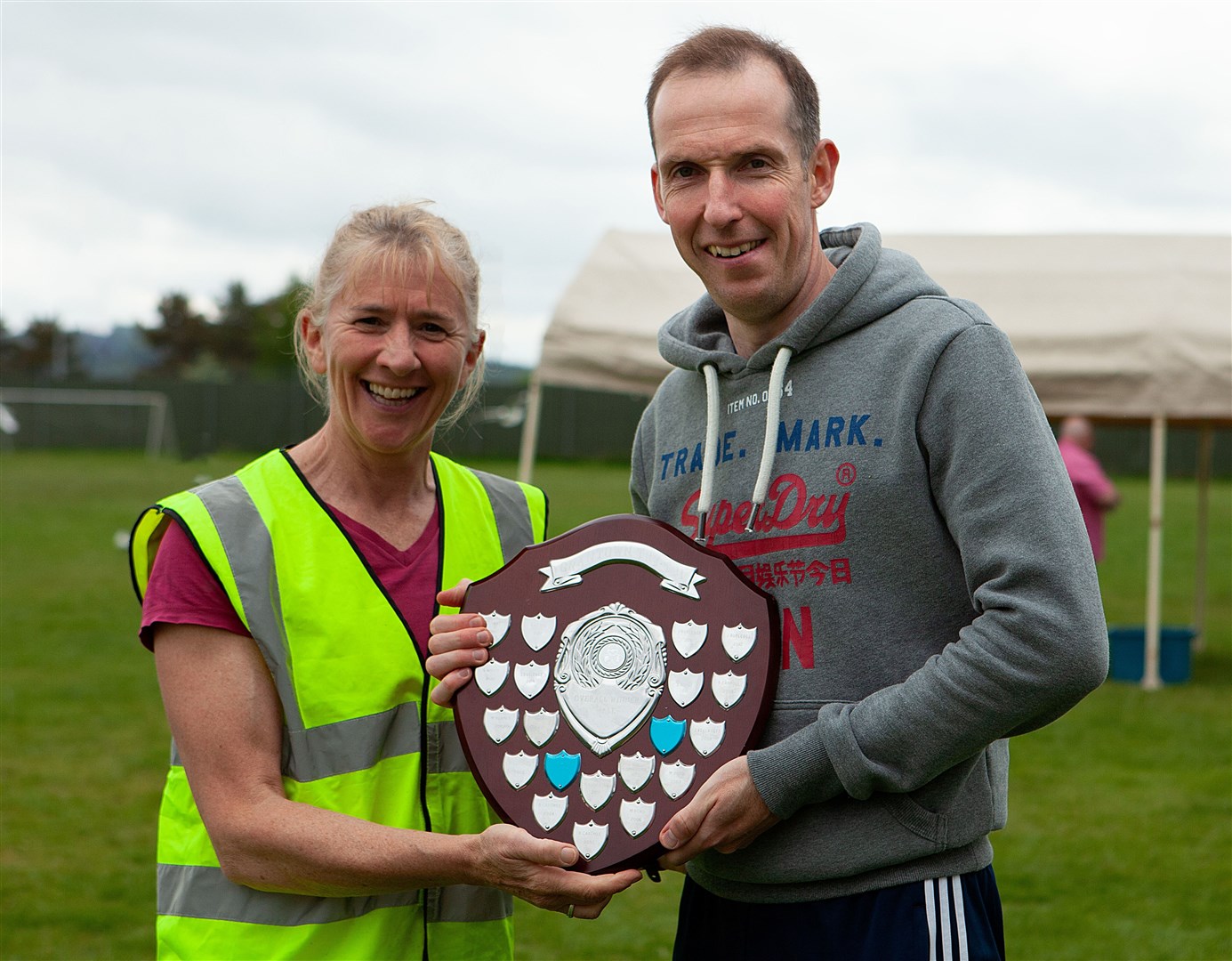Men's winner Andrew McGhee accepts his award after defiending his crown.