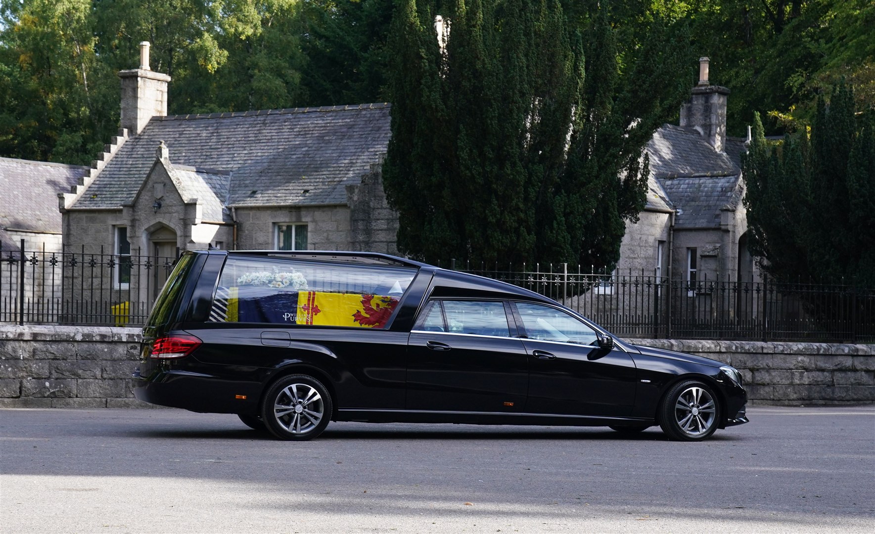 The Queen died peacefully at Balmoral on September 8, triggering an outpouring of grief both nationally and internationally. Here, the hearse carrying her coffin leaves Balmoral, en route to the Palace of Holyroodhouse in Edinburgh (Owen Humphreys/PA)