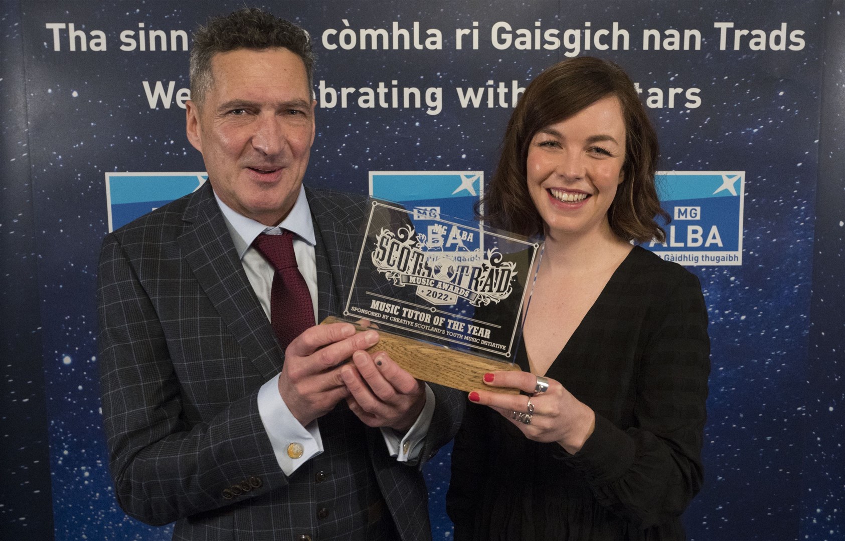 Charlie McKerron accepts his award from Morag MacDonald. Picture: Alan Richardson