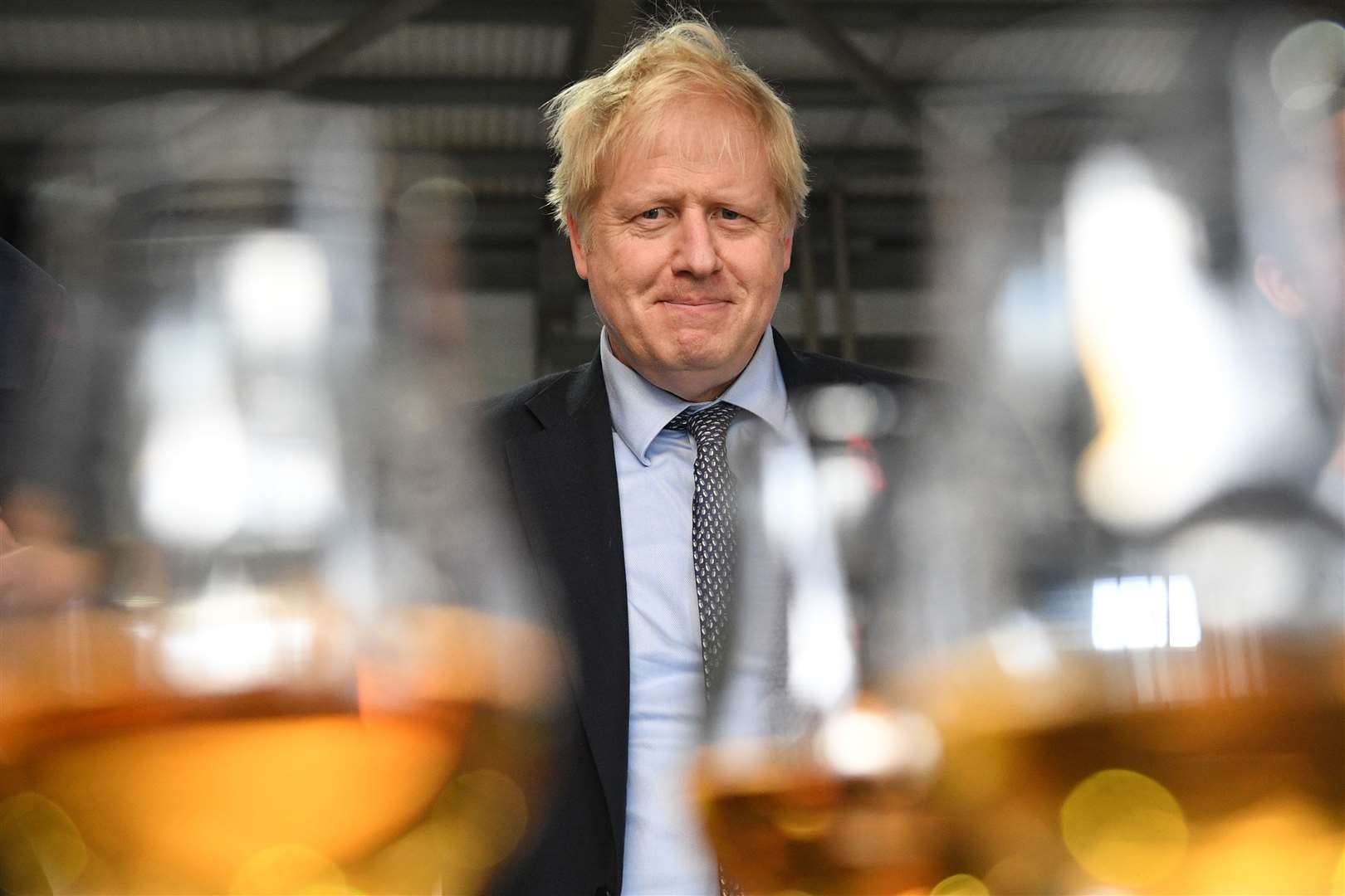 Prime Minister Boris Johnson tastes whisky at the Roseisle Distillery. Picture: (Stefan Rousseau/PA).