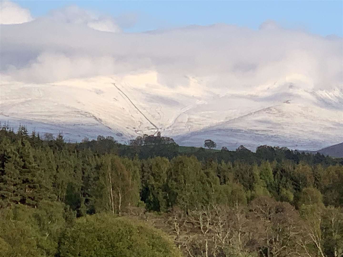 The Cairngorm ski area and wider estate pictured from the Spey Valley Golf Course in Aviemore.