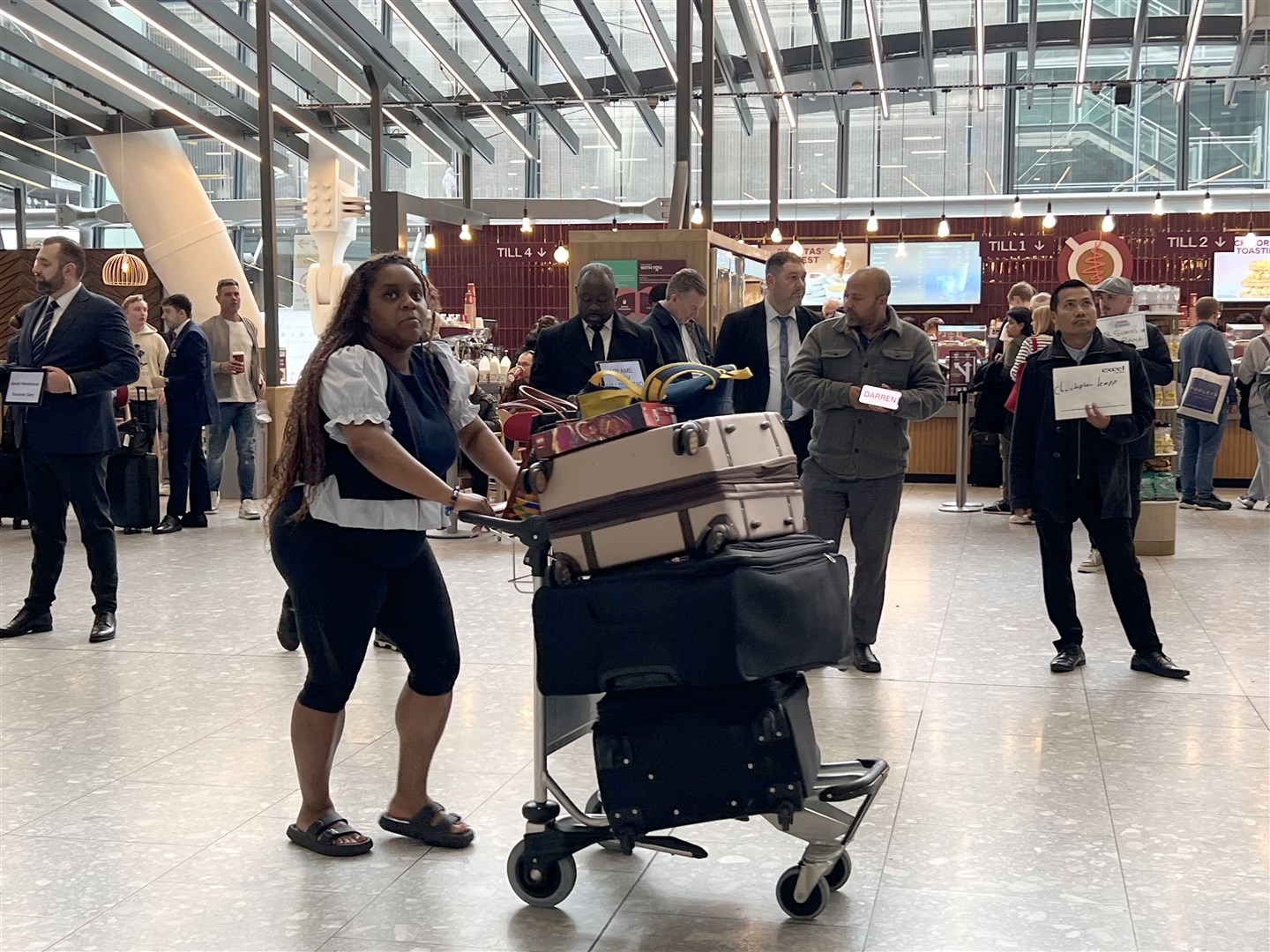 Passengers in the arrivals hall at Heathrow Terminal 5 after flights resumed following a blaze that knocked out an electricity substation in Hayes (Maja Smiejkowska/PA)