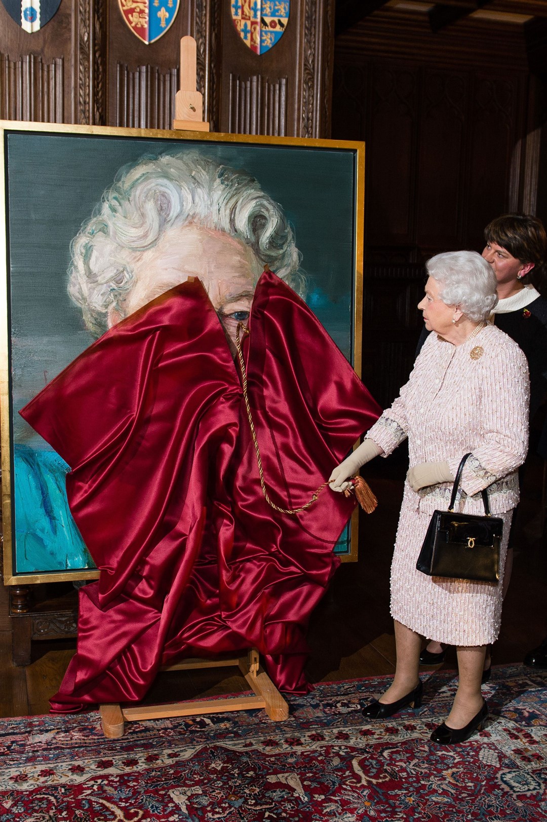 The Queen unveils the portrait of herself by artist Colin Davidson at Crosby Hall (Jeff Spicer/PA)