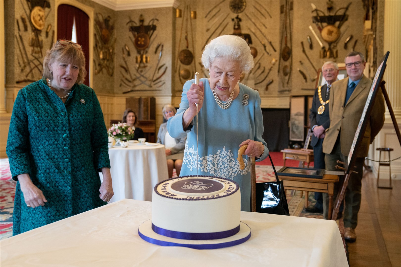 The Queen cuts a cake to celebrate the start of the Platinum Jubilee in February 2022 (Joe Giddens/PA)