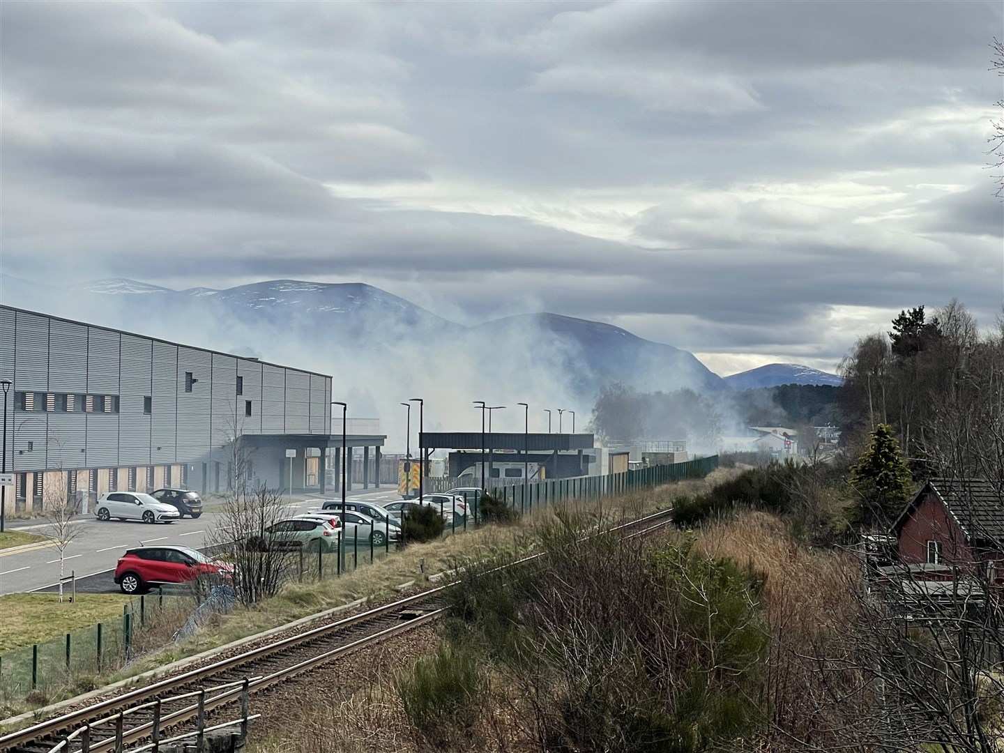 Smoke billows across the from steam railway to mainline yesterday afternoon, over the community hospital buildings along the way.