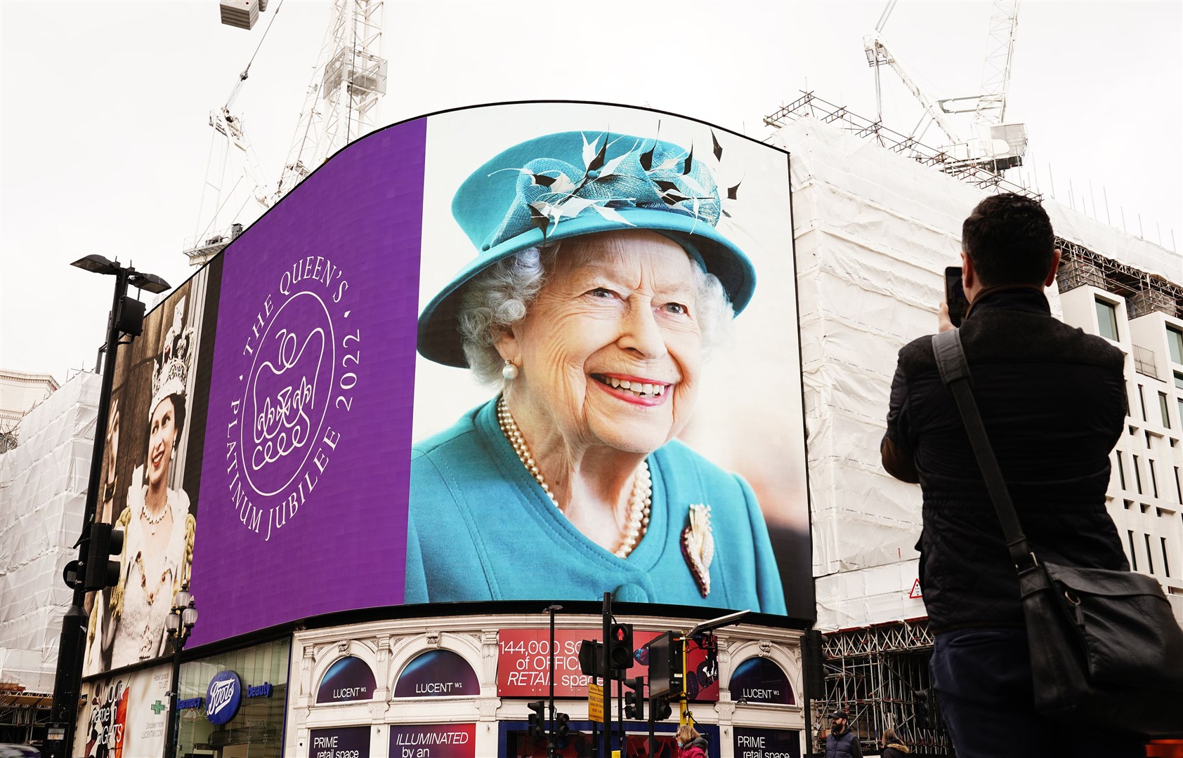 Images of the Queen were displayed on the lights in London’s Piccadilly Circus to mark her Platinum Jubilee (Ian West/PA)