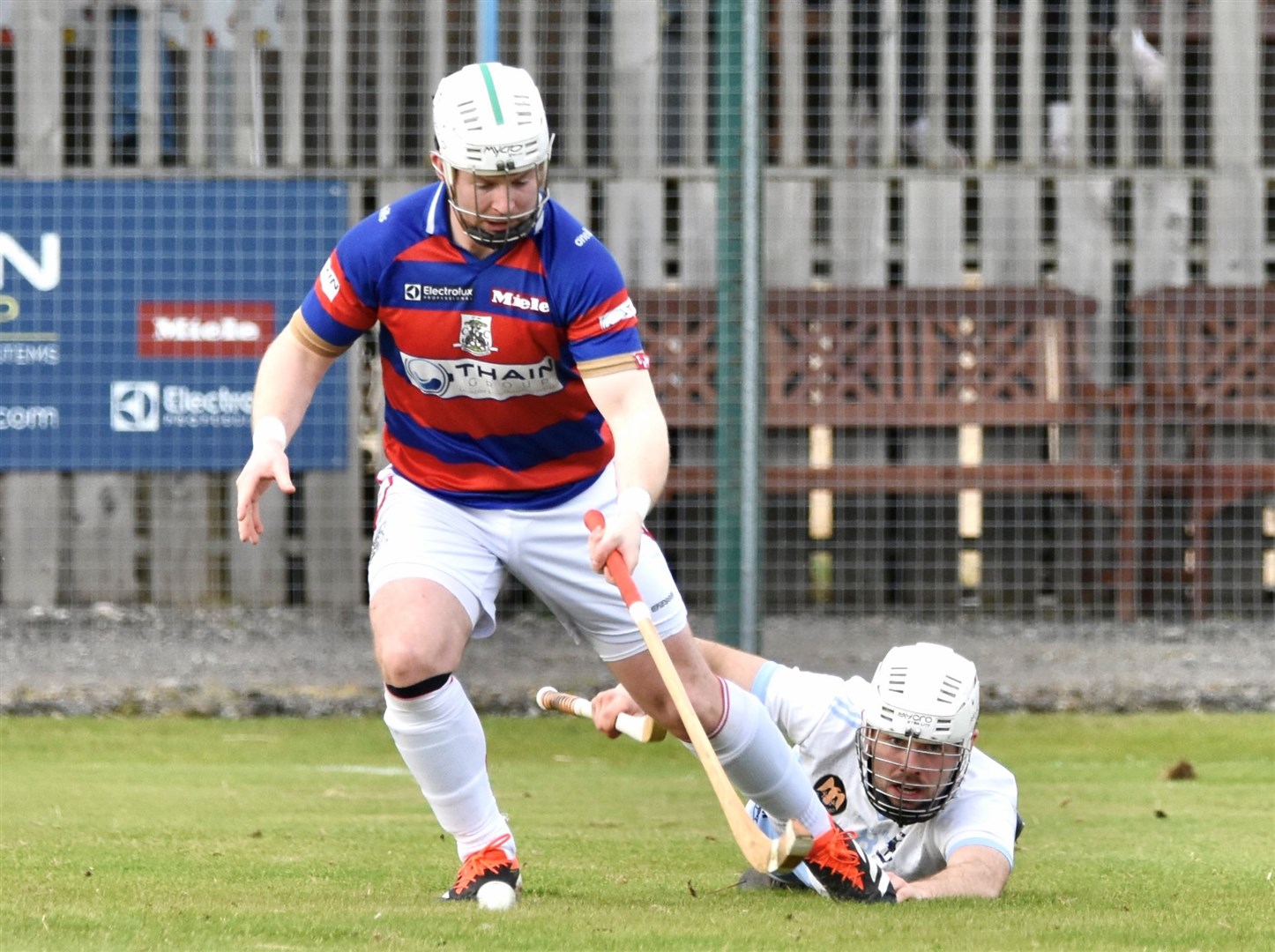 Kingussie's Rory Mackeachan leaves his marker sprawled on the ground during Kingussie's win in at home to Skye. Picture: Fiona Young.