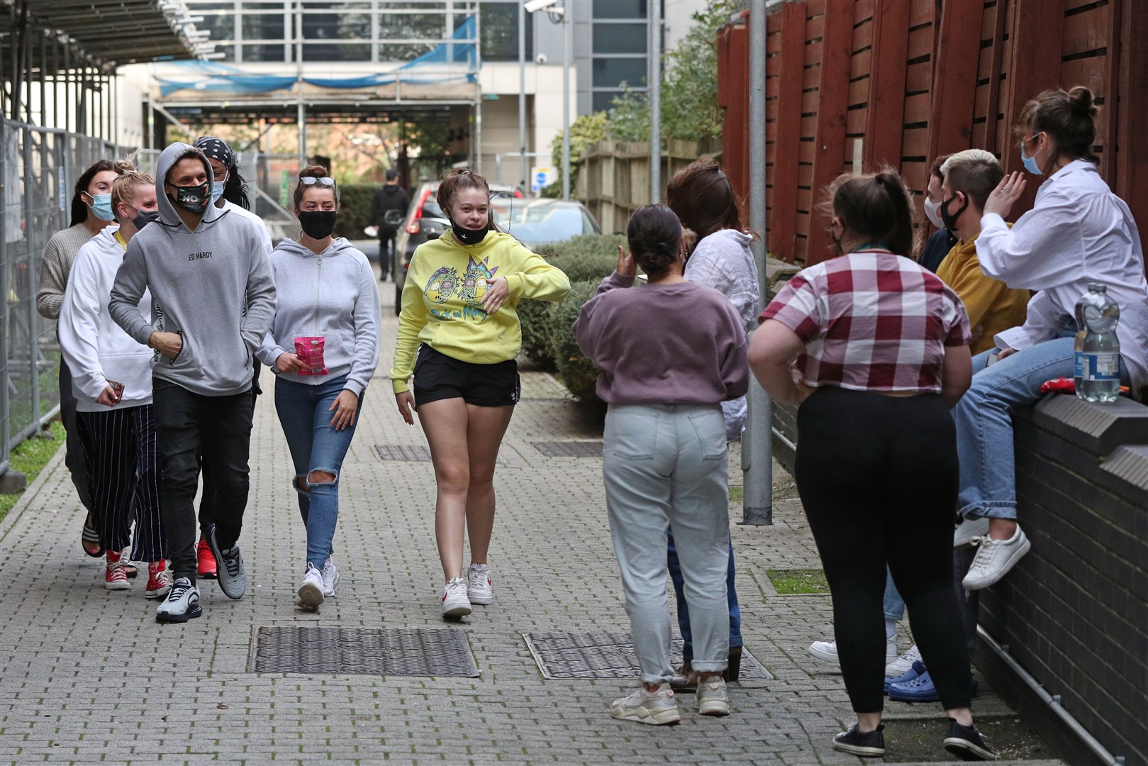 Students gathered outside block F on the Paragon estate in Brentford, west London, where around 1,000 people are being asked to “immediately” leave their homes (Jonathan Brady/PA)