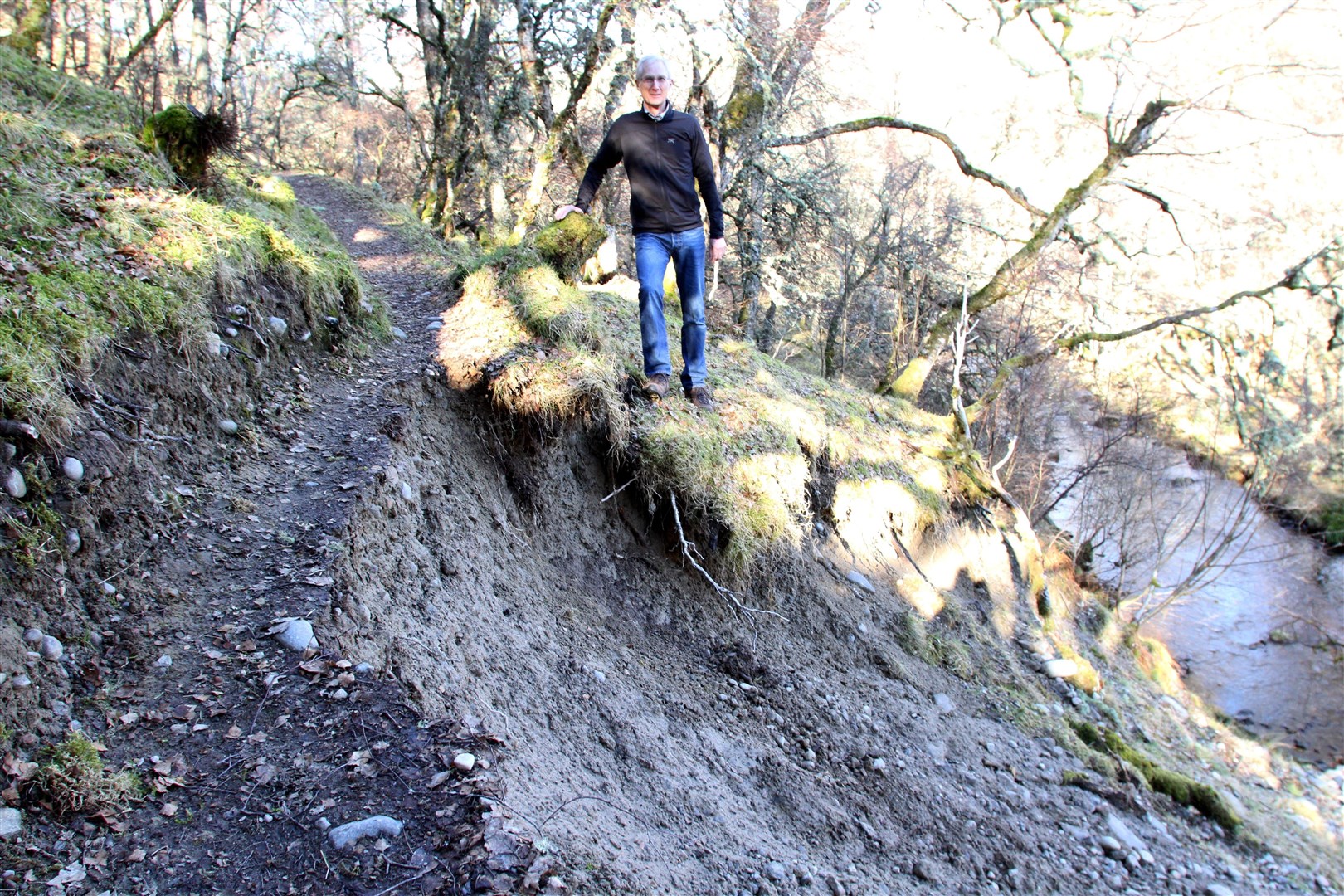 Paul Woolrich at the section of the Newtonmore Wildcat Trail hit by the landslip.