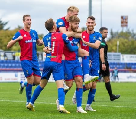 Shaun Rooney celebrates with his teammates after scoring for ICT.