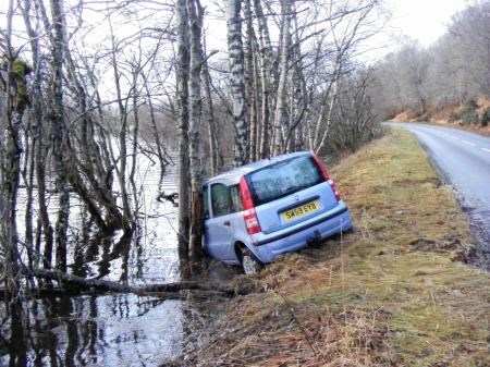 A car in the floodwaters on the B9152 between Aviemore and Kincraig