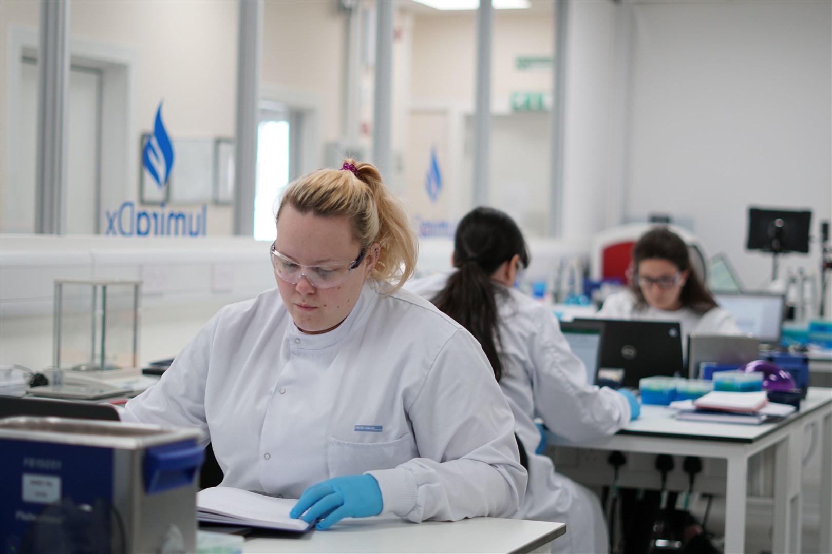 A LumiraDx laboratory scientist at work.