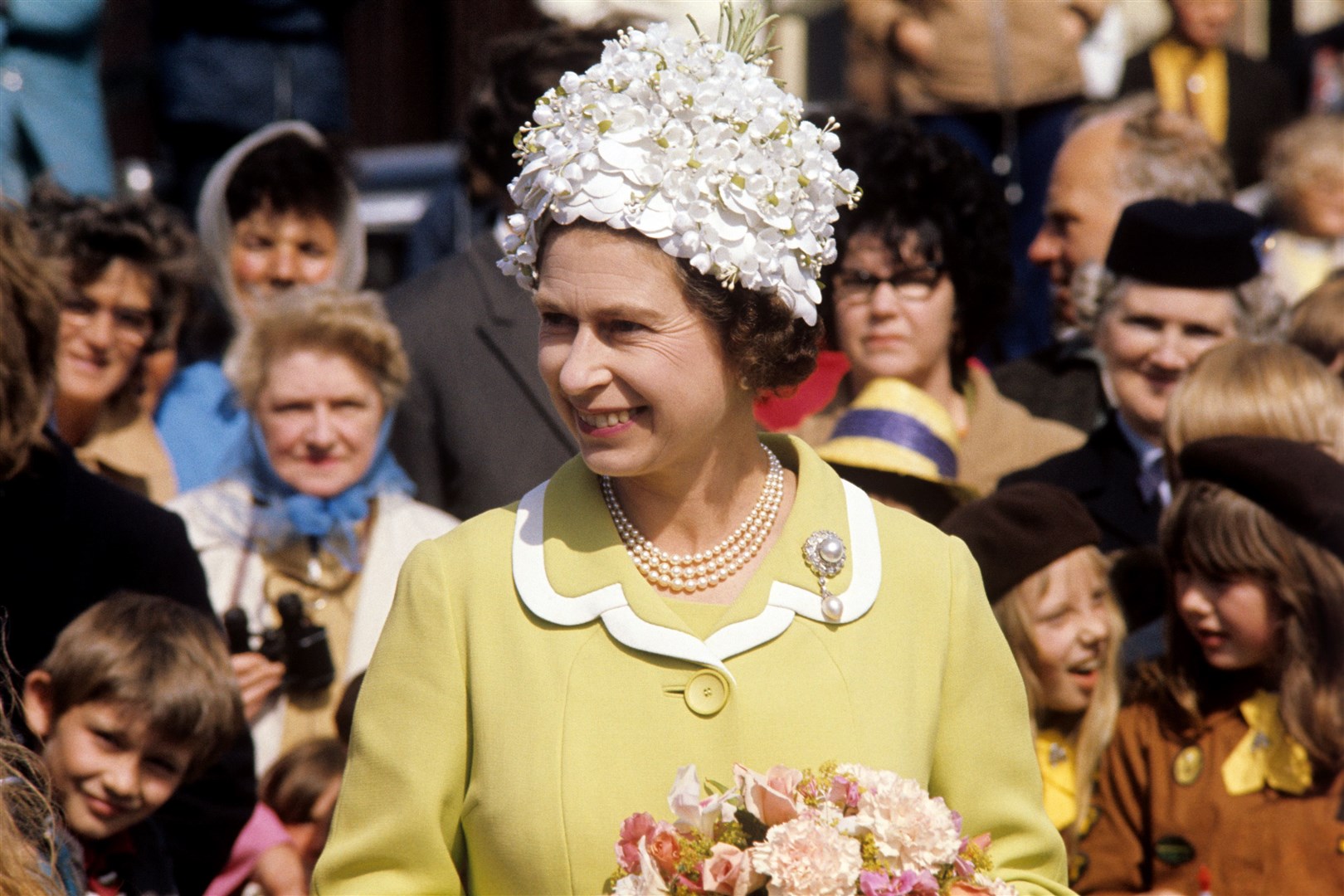 The Queen wearing a petal covered hat on a visit to the Isle of Man in 1972 (PA)