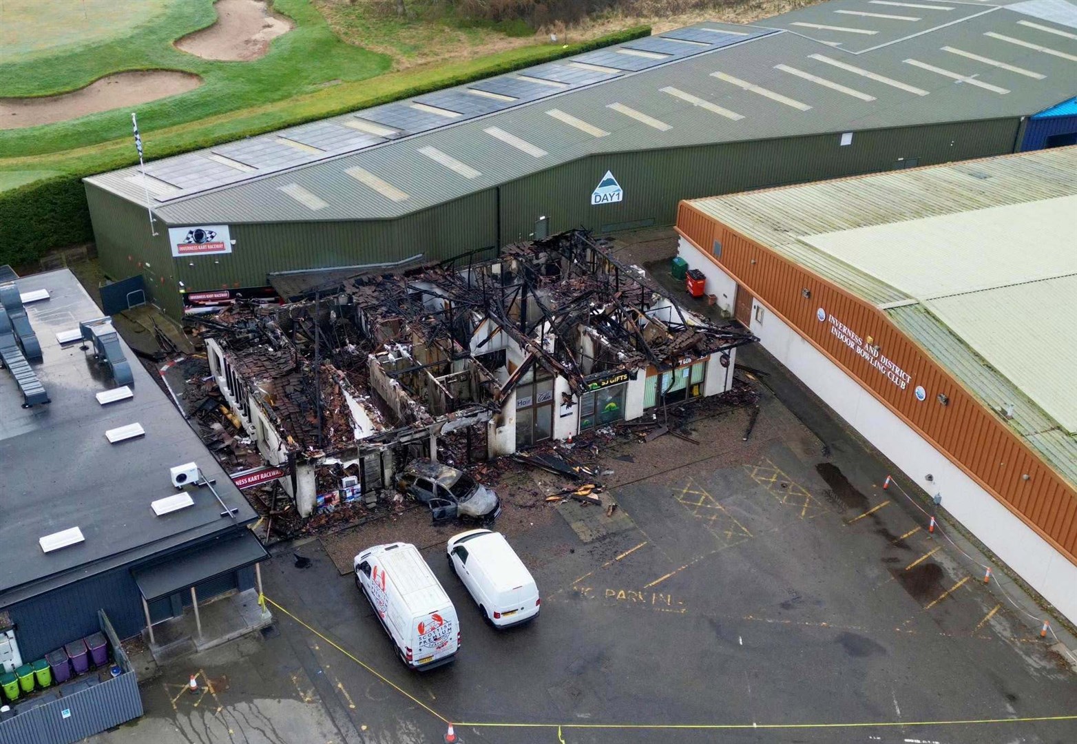 Drone footage reveals the scale of the damage and how close it came to neighbouring buildings. Picture: Walter Geddes.