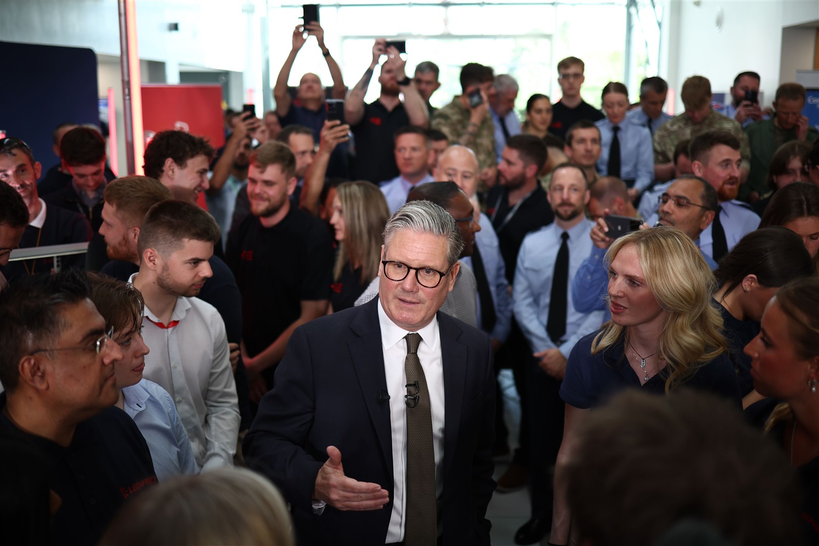 Prime Minister Sir Keir Starmer speaks to members of staff during a visit to Leonardo, a defence contractor in Luton (Henry Nicholls/PA)