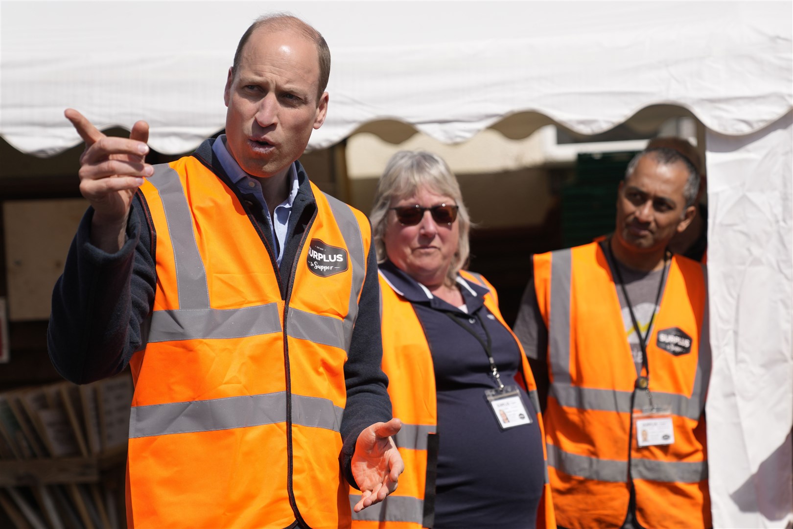William talks to van drivers during a visit to Surplus to Supper in Surrey (Alastair Grant/PA)
