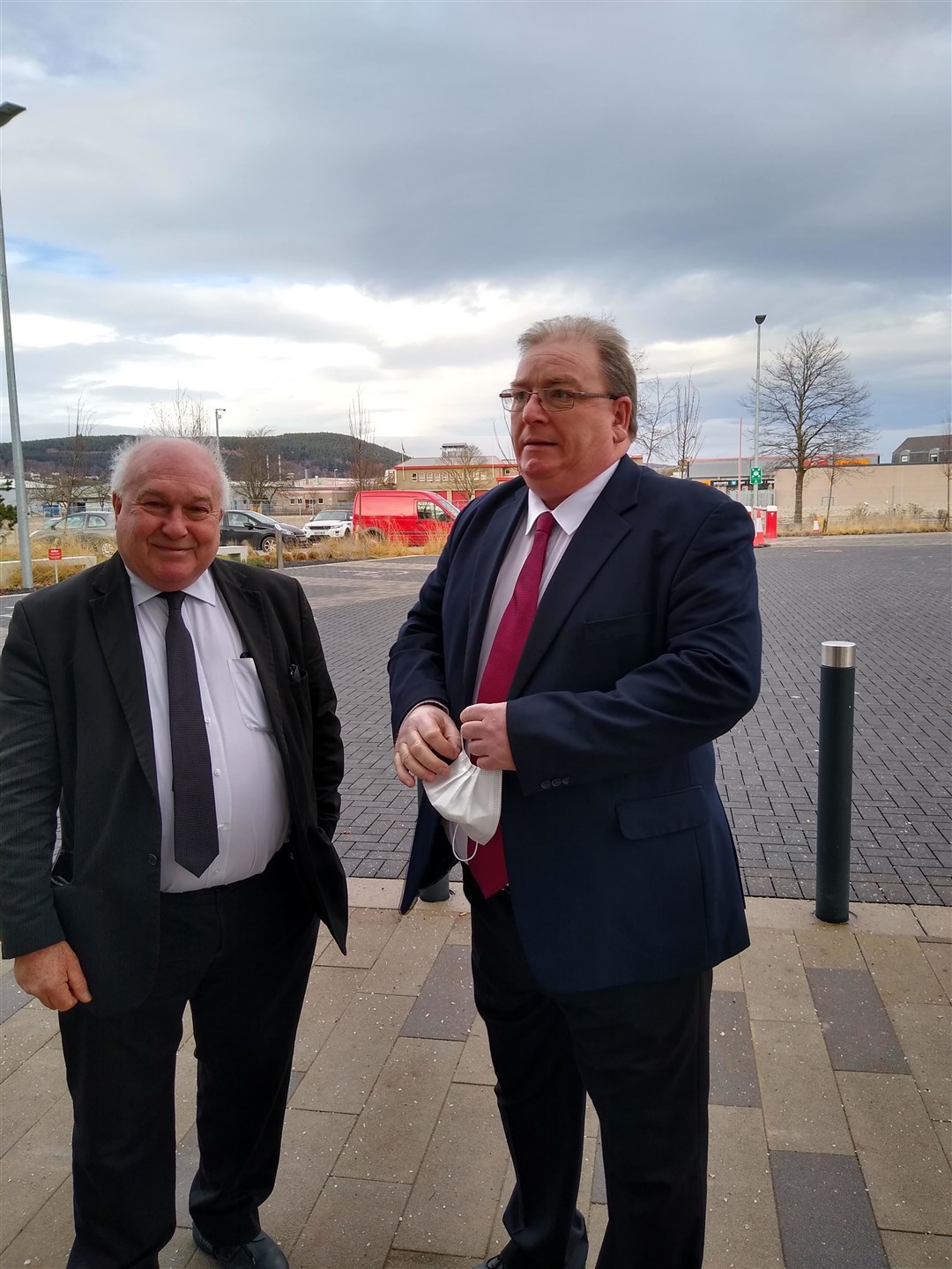 Bus driver Nigel Dunn (right), with his lawyer, outside of the court.