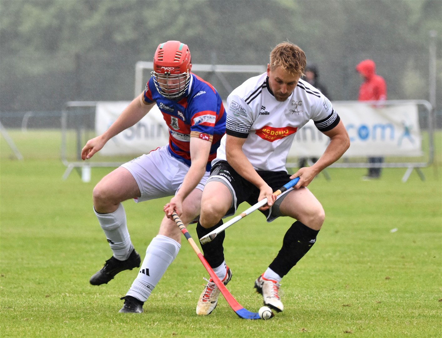 The Kings' Calum Grant and Lovat's Lorne Mckay battle for the ball.