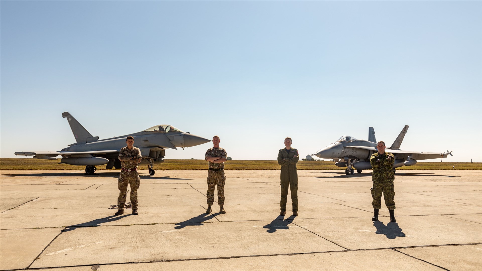 L-R Acting Deployed Operations Base Warrant Officer, Warrant Officer 2nd Class Karl Murley, Commanding Officer 121 Expeditionary Air Wing, Wing Commander Stephen Lamping, Commanding Officer Canadian Air Force Detachment Lieutenant Colonel Corey Mask, and Chief Warrant Officer Todd Farrow.