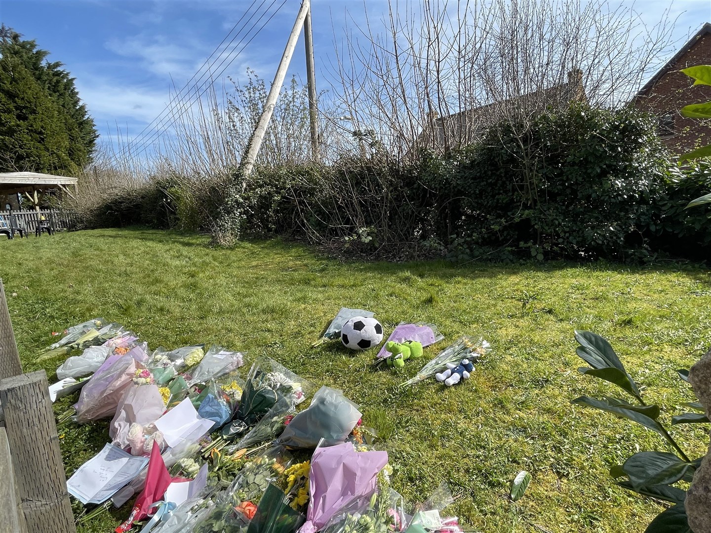Floral tributes near the scene in Beswick Close, off Station Road, in Rushton (Sophie Robinson/PA)