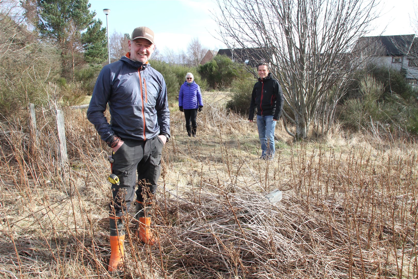 Mike Gale (left) with fellow Aviemore and Glenmore Community Trust members director Janis Bootle and chairman Duncan Swarbrick at the proposed site off Dalfaber Drive.