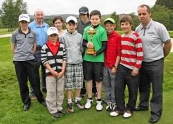 Holding the Ryder Cup is Ian McKenzie along with other junior players and club president Len Cruickshank on left and Robbie MacPherson, junior convener, on right.