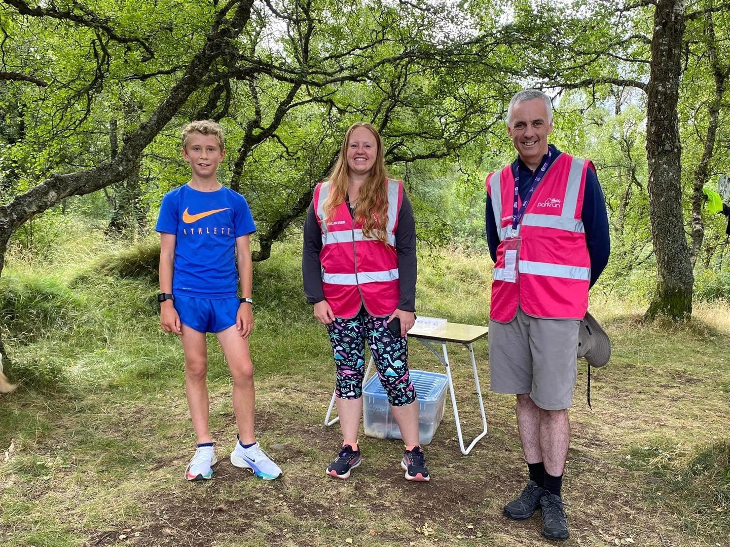 Today's Parkrun: first-placed runner Rory Barclay-Watt from Oxfordshire, with volunteers Vickie Rampton and Iain Atherton.