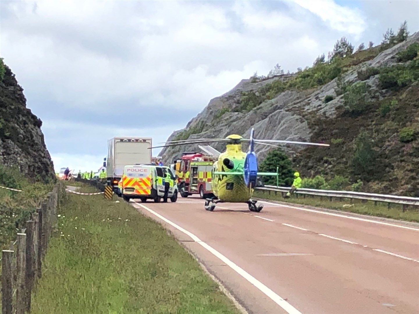Action from the crash scene going on near Carrbridge