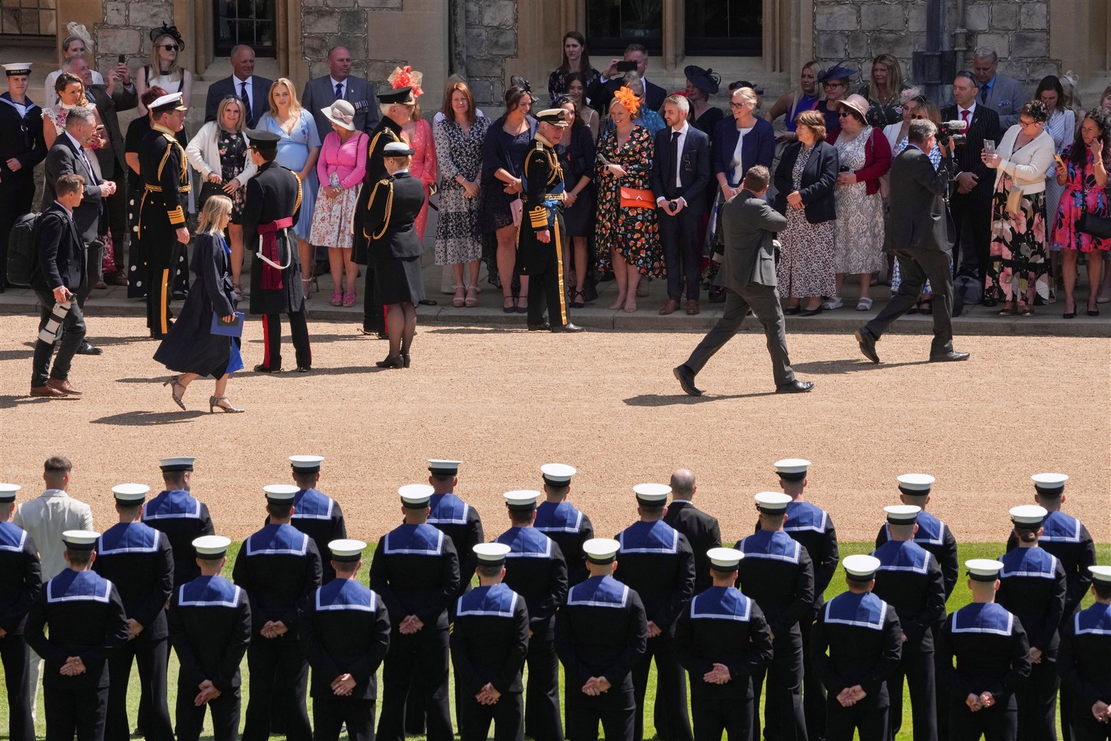The King talks to relatives after presenting the Royal Victorian Order to members of the Royal Navy for their part in the late Queen’s funeral procession (Maja Smiejkowska/PA)
