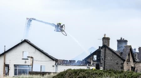 Firefighters tackle the blaze.