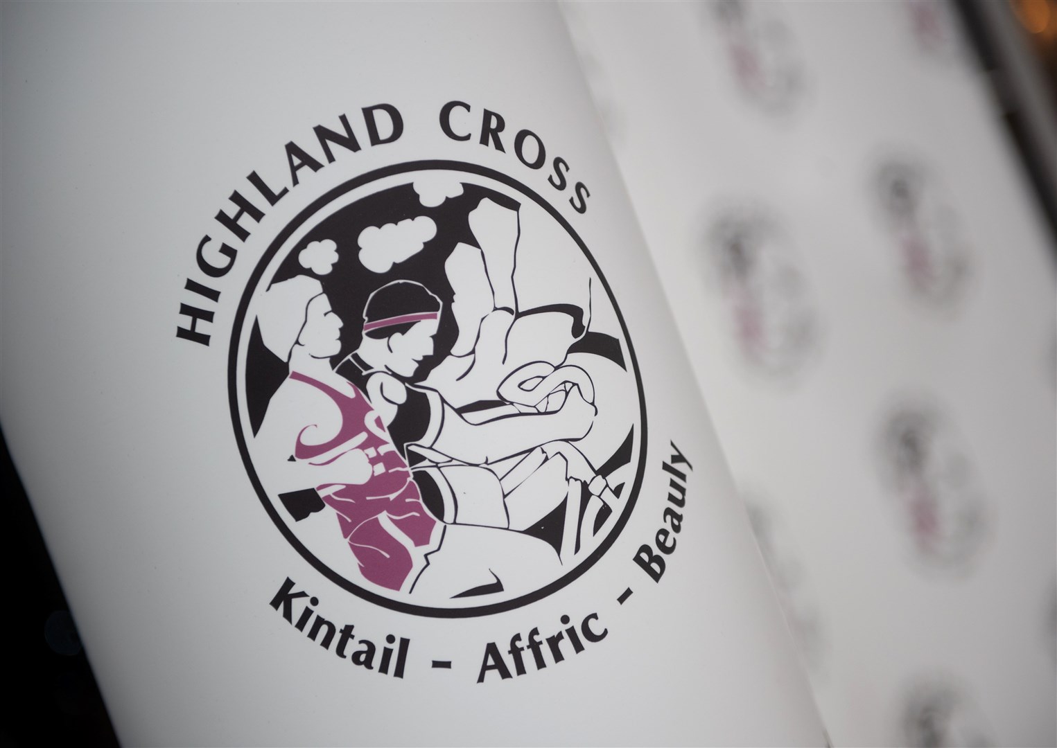 The Highland Cross logo.
