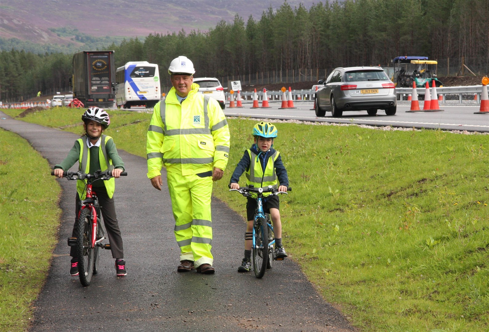 Keith Brown, then Cabinet Secretary for the Economy, on the cycleway constructed by the Dalraddy-Kincraig stretch of the then newly dualled A9 section.