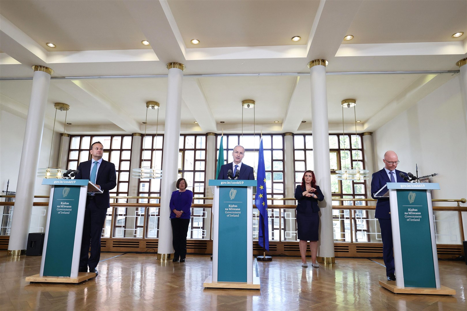 From left, Tanaiste Leo Varadkar, Taoiseach Micheal Martin and Minister for Health, Stephen Donnelly (Julien Behal/PA)