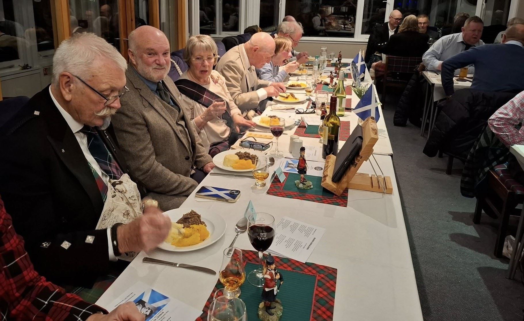 TOP TABLERS: A smile from Newtonmore's own broadcaster walking legend Cameron McNeish, who gave the Immortal Memory.