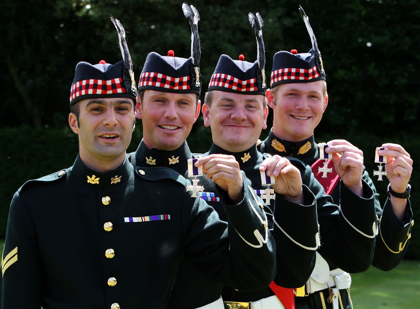 (left – right) Corporal Christopher Reynolds, Corporal Craig Sharp, Corporal Richard Clark and Lieutenant Alexander Phillips of The Royal Regiment of Scotland, who all received the Military Cross from Queen Elizabeth II at an Investiture at the Palace of Holyroodhouse (Andrew Milligan/PA)