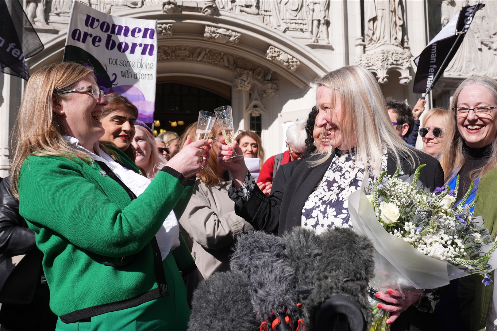 Campaigners celebrated the ruling outside the Supreme Court verdict (Lucy North/PA)