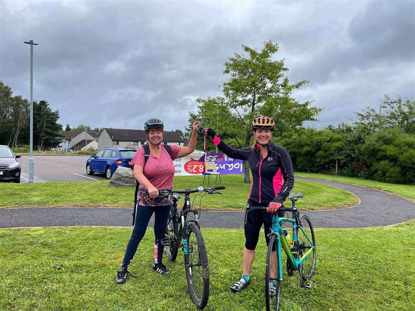 ON DUTY: Louise Orr (left) passes the baton to Dr Gemma Munro during the relay.